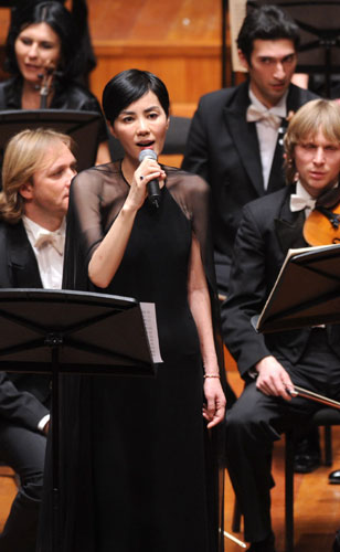 Faye Wong sings at a fundraising concert for the Smile Angel Foundation in 2012. The charity helps Chinese children with cleft palates and lips. Photo: Xinhua