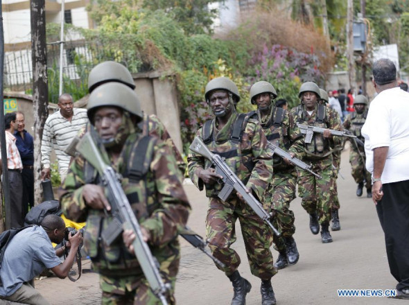 Soldiers arrive at the Westgate shopping mall in Nairobi, Kenya, Sept. 21, 2013. At least 20 people have been killed and more than 50 others wounded when masked gunmen stormed a popular shopping mall in the Kenyan capital Nairobi and held shoppers hostages on Saturday. (Xinhua/Zhang Chen)