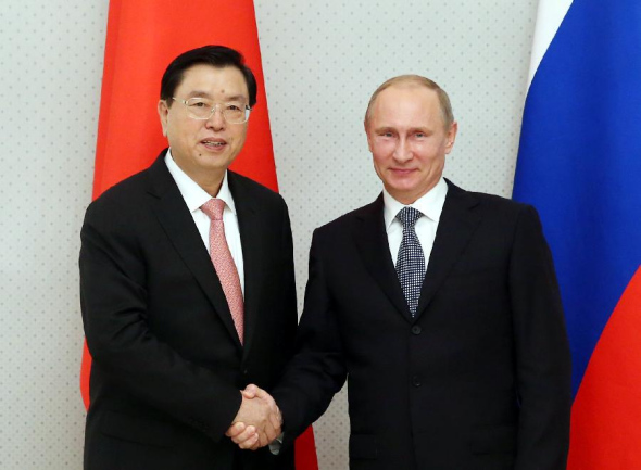 Zhang Dejiang (L), chairman of the Standing Committee of China's National People's Congress, meets with Russian President Vladimir Putin in Sochi, Russia, Sept. 23, 2013. (Xinhua/Yao Dawei)