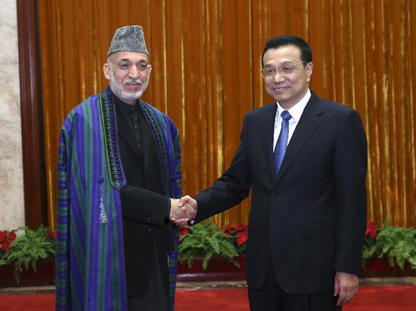 Chinese Premier Li Keqiang (R) meets with Afghan President Hamid Karzai in Beijing, capital of China, Sept. 27, 2013. (Xinhua/Pang Xinglei)