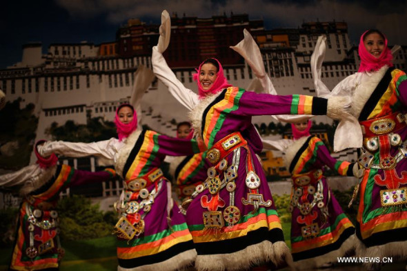 Performers dance during the opening ceremony of the 2013 Germany China Tibetan Culture Week in Berlin, Germany on Oct. 23, 2013. The 2013 Germany China Tibetan Culture Week opened here on Wednesday, aiming to give the German people a glimpse of Tibet and its traditional culture. (Xinhua/Zhang Fan) 