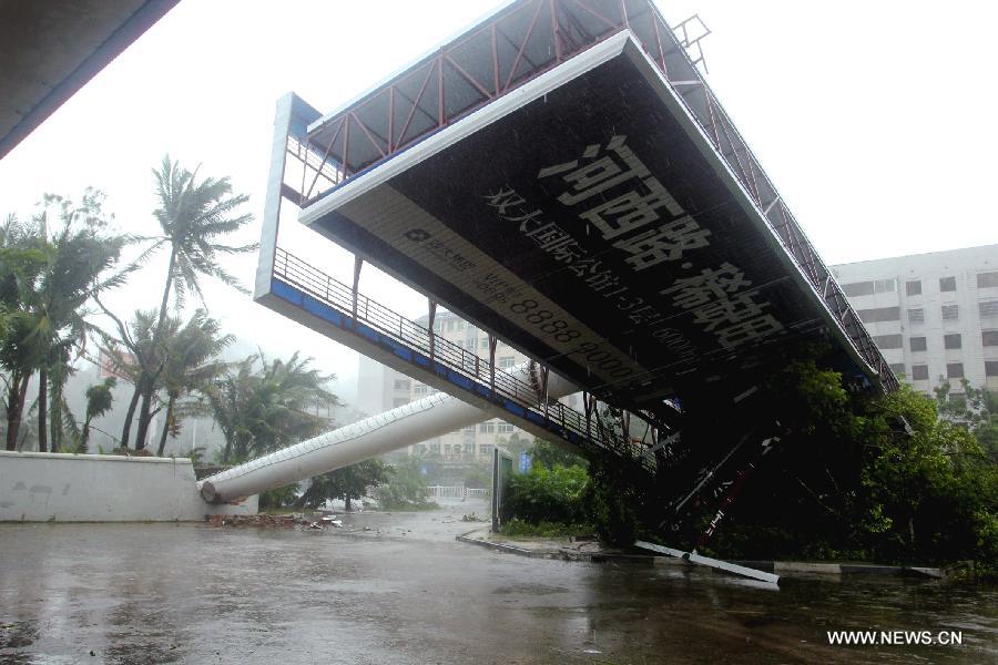 A large billboard is blown down by strong wind as Typhoon Haiyan approaches Sanya city, south China's Hainan province, Nov. 10, 2013. Haiyan, the 30th and strongest typhoon to hit China this year, is bringing downpours and strong wind to Hainan. As of 3:00 p.m. Sunday, Haiyan had also delayed 187 flights at Sanya Phoenix Airport. (Xinhua/Yuan Yongdong) 