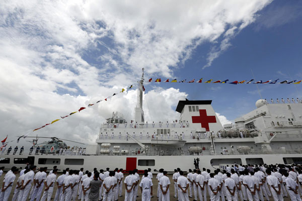 Chinese hospital ship Peace Ark arrives at Thilawa Port in Yangon, Myanmar, Aug 28, 2013, as part of an overseas voyage to provide medical services to local residents. China has also offered to send its hospital ship, the Peace Ark, to the country's areas hardly ravaged by Typhoon Haiyan, said Chinese Foreign Ministry spokesman Hong Lei.[Photo/Xinhua]