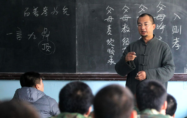 Addicts attend a Chinese culture class. Seventy 'problem teenagers' receive special treatment at Beijing Qide Education Center, where they hope to find a cure for their addiction to the Internet. Photos by Zou Hong / China Daily