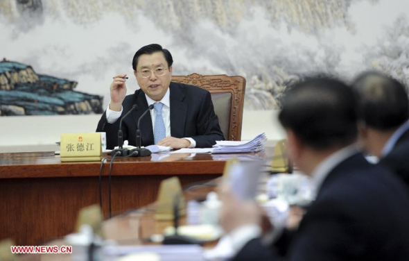 Zhang Dejiang, chairman of the Standing Committee of the National People's Congress (NPC), presides over the 14th meeting of the Chairmen's Council of the 12th NPC Standing Committee at the Great Hall of the People in Beijing, capital of China, Dec. 16, 2013. (Xinhua/Zhang Duo)