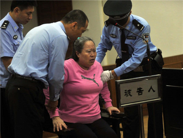 Ding Shumiao stands graft trial at the No 2 Beijing Intermediate People's Court on Sept 24, 2013. [Photo/Xinhua]