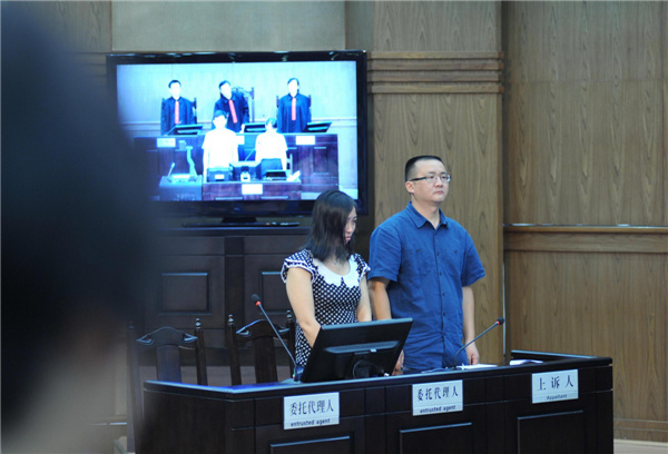 Tang Hui during the trial at the Hunan Provincial People's High Court on July 152013. Tang was put into the labor camp after she publicly petitioned for harsher punishments for those found guilty of raping her daughter and forcing her into prostitution. [Photo/Xinhua]