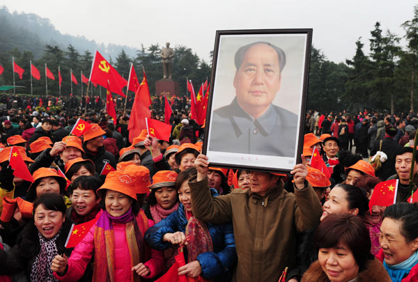 People mark the 120th anniversary of Mao Zedong's birth in Shaoshan, Hunan province, on Thursday. Guo Liliang / for China Daily