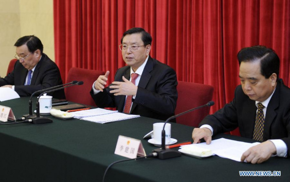 Zhang Dejiang (C), chairman of the Standing Committee of China's National People's Congress (NPC), attends the inaugural meeting of a seminar studying China's NPC system in Beijing, capital of China, Jan. 7, 2014. (Xinhua/Zhang Duo)