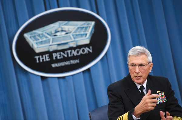 Admiral Samuel Locklear III, commander of US Pacific Command, delivers remarks during a press conference at the Pentagon in Washington, DC, January 23, 2014. AFP PHOTO / Jim WATSON