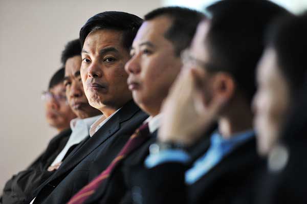 Thirty-three sub-directors of the Dongguan Social Security Department hear a trial involving Liang Bing, director of the department, who was a defendant in a case involving disputes over work injuries in November in Guangdong province. Provided to China Daily