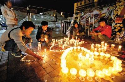 Kunming residents have held a vigil at the train station for  the 29 victims.