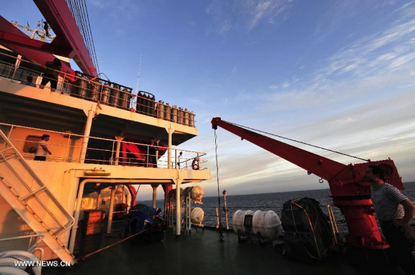 The Chinese icebreaker Xuelong, or Snow Dragon, awaits orders for the search of missing Malaysia Airlines flight MH370 at the port of Perth, a southwestern port city of Australia, March 20, 2014. (Xinhua/Tang Zhijian)