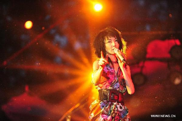 Hong Kong film star Maggie Cheung performs during the 2014 Strawberry Music Festival in Beijing, capital of China, May 3, 2014. [Photo/Xinhua]