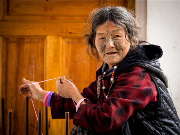 Living in the Dulong River valleys, the Derung people are known for their tradition of facial tattooing adult women. Cheng Bin / For China Daily