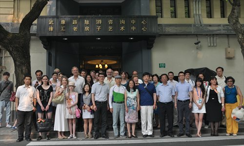 Participants of a walking tour pose for a group photo Saturday.