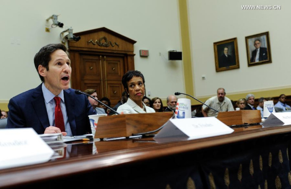 Tom Frieden (L), director of the U.S. Centers for Disease Control and Prevention (CDC), speaks during a hearing on combating the Ebola threat, on Capitol Hill in Washington D.C., capital of the United States, Aug. 7, 2014. CDC Director Tom Frieden said Thursday he has activated the level of the agency's response to the west African Ebola outbreak to its highest alert status.(Xinhua/Bao Dandan)