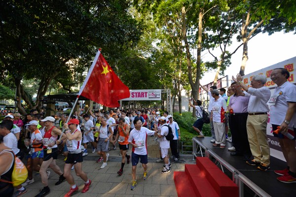 People participate in a march against the Occupy Central campaign in Hong Kong, August 17, 2014. [Photo/Xinhua]