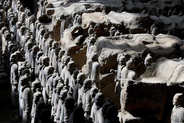 Warriors in Pit 1 at the Qin Shi Huang Mausoleum Museum in Xi'an, Shaanxi province. After 40 years of careful and extensive excavation, archaelogists are still discovering new figures, and more facts about one of China's premier historical sites are coming to light. [Photo by Lin Mingfang/Xinhua]