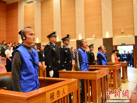 The Higher People's Court of Yunnan province holds an open court over a terrorist attack at a railway station in Kunming earlier this year. (Photo/Chinanews.com) 