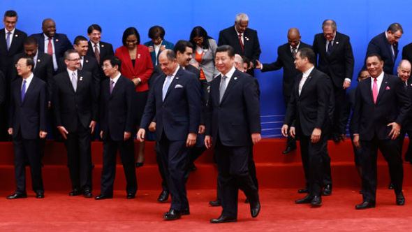 President Xi Jinping and guests attend a photo session during the opening ceremony of the first Ministerial Meeting between China and the Community of Latin American and Caribbean States. FENG YONGBIN / CHINA DAILY