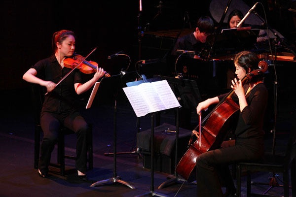 Performers playing composer Sam Wu's Dolphin Song at the Asia Society in New York on Tuesday. Amy He / China Daily. 