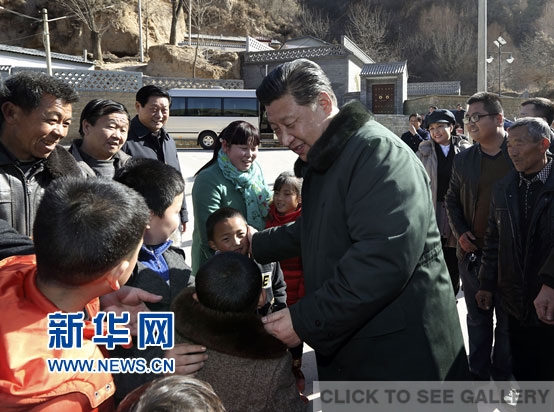 Chinese president Xi Jinping meets the residents of Liangjiahe, Yan'an city, northwest China's Shaanxi province on Friday, Feb 13, 2015. Xi and his wife Peng Liyuan returned to Liangjiahe, a revolutionary base in Shaanxi province. [Photo: Xinhua]