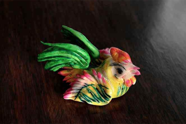 Photo shows a rooster-shaped huamo. (people.cn)