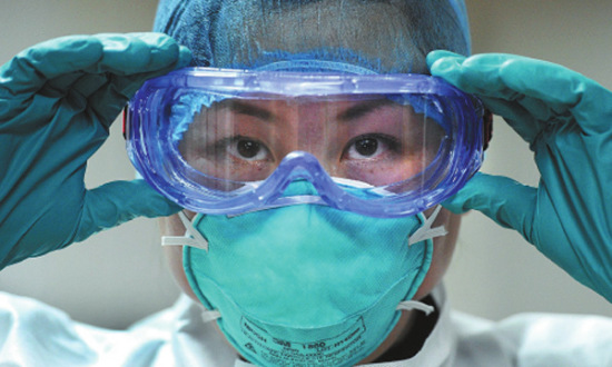 Fan Yi, a nurse from Beijing, is a member of a Chinese medical team sent to Liberia to fight Ebola. YU PING/CHINA DAILY