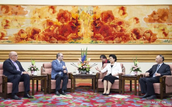 Chinese Vice Premier Liu Yandong (2nd R) meets with Patrick Baumann (2nd L), secretary-general of the International Basketball Federation (FIBA), and Burton Shipley (1st L), president of the FIBA Oceania, in Beijing, capital of China, May 7, 2015. (Xinhua/Wang Ye)