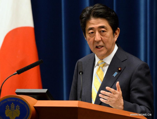 Japan's Prime Minister Shinzo Abe speaks at a press conference following a cabinet meeting which approved a legislative package on national security, at his official residence in Tokyo on May 14, 2015. The Cabinet of Japan on Thursday approved a legislative package on national security which will allow the Self-Defense Forces to fight abroad, marking a major change to Japan's post-war exclusively defense-oriented security policy. (Xinhua/Ma Ping)