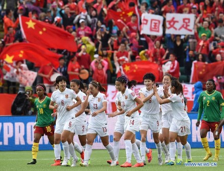 China's Wang Shanshan (4th R) celebrates after scoring during a round of 16 match between China and Cameroon at the Commonwealth Stadium in Edmonton, Canada, on June 20, 2015. China won 1-0. (Xinhua/Wang Yuguo)