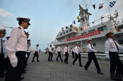 Officers with the Hainan Maritime Safety Administration board a ship in Sanya, Hainan Province, on April 21, for a patrol mission off the Xisha Islands in the South China Sea (XINHUA)