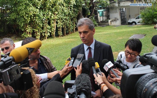 Dominique Sorain, La Reunion's administrator, talks to media after a press conference on search plan for MH370 debris in Reunion Island, on Aug. 7, 2015. Authority of France's oversea island La Reunion has confirmed the plan of search for more MH370 parts and said the search will last for at least one week. (Photo: Xinhua/Romain Latournerie)