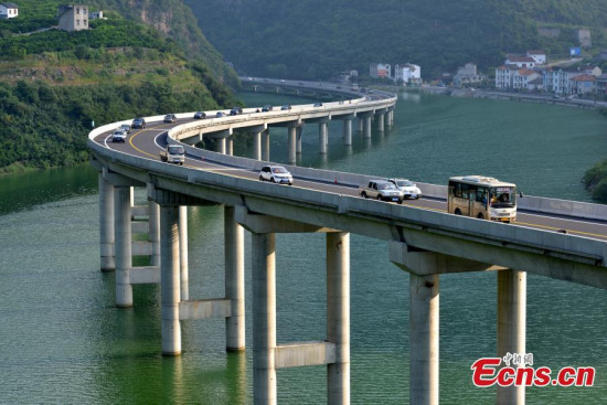 A new highway elevated above water has been officially opened in Xingshan county, Central Chinas Hubei province, Aug 9, 2015. To avoid cutting through forest or tunneling through earth, an approximately 4km stretch of highway has been built above a river that runs through mountains. Those involved in the project are claiming it to be Chinas first ecological overwater road. (Photo: China News Service/Liu Liangwei)