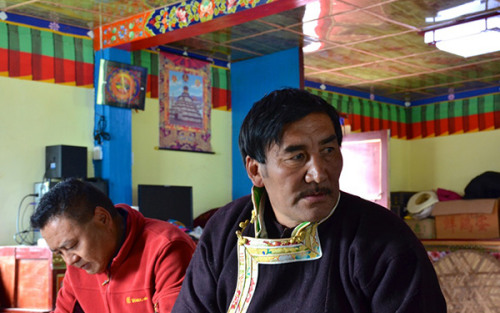 Tashigang village head Pasang Tsering, right. (Photo by Chen Bei/chinadaily.com.cn)