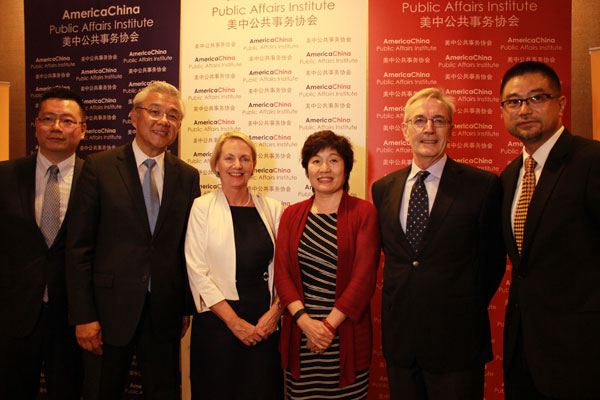 Zhang Qiyue, China's consul general (in red), attends screening of Shanghai Ghetto at Cinema 123 in New York on Tuesday with (from left) Eric Yuan of the America China Public Affairs Institute; Fred Teng, institute president; Kerry Minchin; her husband Nick Minchin, Australia consul general in New York; and Alan Way of the institute. Li Jing / China daily