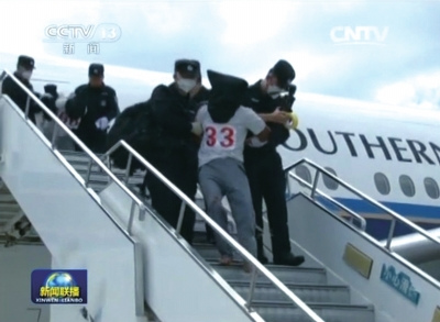 A screen grab from state broadcaster CCTV shows that illegal immigrants were repatriated from Thailand to China on July 9, 2015.