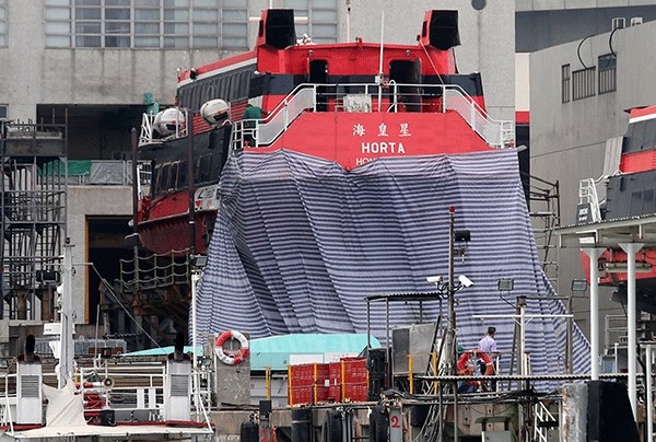 The ferry involved in Sunday night's accident has been towed to the Cheung Sha Wan dock for inspection. More than 30 people remained hospitalized on Monday following the accident near Lantau.(Photo: China Daily/Edmond Tang)