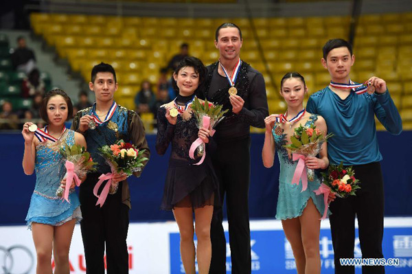 Gold medalists Yuko Kavaguti (3rd L) and Alexander Smirnov (3rd R) of Russia, silver medalists Sui Wenjing (1st L) and Han Cong (2rd L) of China and bronze medalists Yu Xiaoyu (2nd R) and Jin Yang of China pose during the awarding ceremony of the pairs category at the 2015 Audi Cup ISU Grand Prix of Figure Skating in Beijing, capital of China, on Nov. 7, 2015. (Xinhua/Guo Yong)