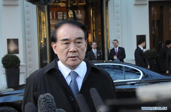 Chinese Vice Foreign Minister Li Baodong speaks to media upon his arrival at the site of the second Vienna meeting on the Syria crisis in Vienna, Austria, on Oct. 14. 2015. (Photo: Xinhua/Liu Xiang)