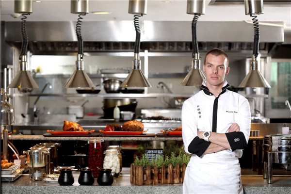 Chef Bradley Hull in his Shanghai restaurant kitchen. (Photo provided to China Daily)