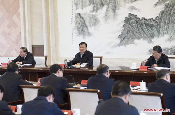 Liu Yunshan (C, rear), a member of the Standing Committee of the Political Bureau of the Communist Party of China (CPC) Central Committee, attends a meeting to promote the three stricts and three earnests campaign, a series of requirements for officials to improve their lifestyles and work, in Nanchang, east China's Jiangxi Province, Dec. 4, 2015. (Xinhua/Wang Ye)