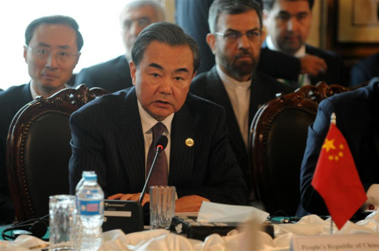 Chinese Foreign Minister Wang Yi delivers a speech at the fifth ministerial meeting of the Heart of Asia-Iatanbul Process in Islamabad, capital of Pakistan, on Dec. 9, 2015. (Xinhua/Ahmad Kamal)