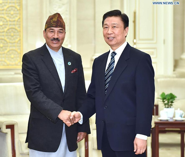 Chinese Vice President Li Yuanchao (R) meets with visiting Nepalese Deputy Prime Minister Kamal Thapa, also Nepal's foreign minister, in Beijing, capital of China, Dec. 24, 2015. (Photo: Xinhua/Li Tao)