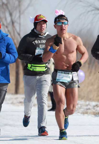 Zhang Guocai runs a marathon in Beijing in January. Photo provided to China Daily