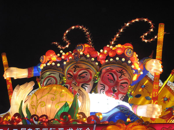 Lanterns featuring three faces of the Monkey King greet visitors at an entrance to the lantern fair in Zigong, Sichuan province. (Photo by Huang Zhiling/chinadaily.com.cn)