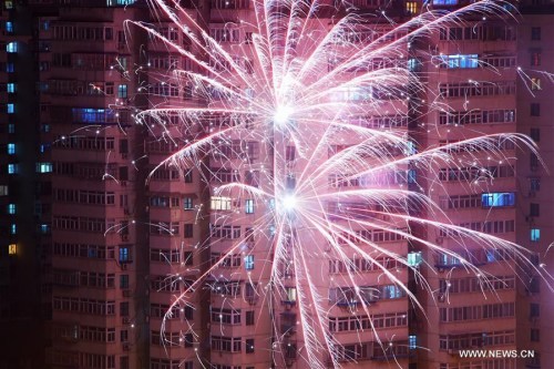 Fireworks burst in midair in Beijing, capital of China, late Feb. 7, 2016, the eve of the Chinese Lunar New Year.