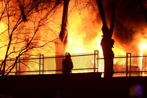 Flames are seen near the site of an explosion in downtown Ankara, Turkey, Feb. 17, 2016. At least 28 people were killed and 61 others wounded in a car bomb attack targeting the Turkish military in the capital Ankara on Wednesday, the Ankara governor said. (Xinhua/Mustafa Kaya)