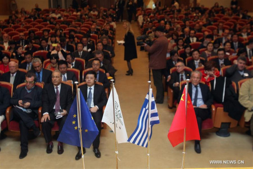 Officials and representatives of universities from Greece and China attend the symposium on higher education and research cooperation between the two countries in Athens, Greece, on Feb. 23, 2016. (Photo: Xinhua/Marios Lolos)